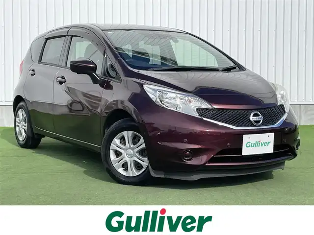 日産 ノート X 香川県 2016(平28)年 3.2万km フランボワーズレッド 登録時走行距離：31424km/エマージェンシーブレーキ/車線逸脱警報/純正SDナビゲーション/→フルセグTV/→CD/DVD再生/アラウンドビューモニター/ETC/ドライブレコーダー/ステアリングリモコン/オートエアコン/ヘッドライトレベライザー/スマートキー/プッシュスタート/横滑り防止装置/純正フロアマット