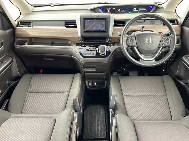 ホンダ フリード ハイブリット G ホンダセンシング 道央・札幌 2021(令3)年 5万km クリスタルブラックパール ・社外メモリナビ/　CD/BT/ワンセグTV/・バックカメラ/・両側パワースライドドア/・HONDA SENSING/　衝突軽減ブレーキ/　誤発進抑制(前後)/　事故低減ステアリング/　路外逸脱抑制/　アダプティブクルーズコントロール/　車線維持支援/　標識認識/　オートハイビーム/・前席シートヒーター/・オートリトラミラー/・ワイパーデアイサー /・オートライト/・LEDヘッドライト/・後席シェード/・純正フロアマット/・ビルトインETC