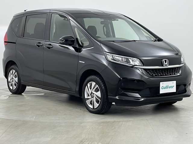 ホンダ フリード ハイブリット G ホンダセンシング 道央・札幌 2021(令3)年 5万km クリスタルブラックパール ・社外メモリナビ/　CD/BT/ワンセグTV/・バックカメラ/・両側パワースライドドア/・HONDA SENSING/　衝突軽減ブレーキ/　誤発進抑制(前後)/　事故低減ステアリング/　路外逸脱抑制/　アダプティブクルーズコントロール/　車線維持支援/　標識認識/　オートハイビーム/・前席シートヒーター/・オートリトラミラー/・ワイパーデアイサー /・オートライト/・LEDヘッドライト/・後席シェード/・純正フロアマット/・ビルトインETC