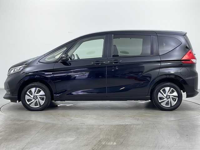 ホンダ フリード ハイブリット G ホンダセンシング 道央・札幌 2021(令3)年 5万km クリスタルブラックパール ・社外メモリナビ/　CD/BT/ワンセグTV/・バックカメラ/・両側パワースライドドア/・HONDA SENSING/　衝突軽減ブレーキ/　誤発進抑制(前後)/　事故低減ステアリング/　路外逸脱抑制/　アダプティブクルーズコントロール/　車線維持支援/　標識認識/　オートハイビーム/・前席シートヒーター/・オートリトラミラー/・ワイパーデアイサー /・オートライト/・LEDヘッドライト/・後席シェード/・純正フロアマット/・ビルトインETC