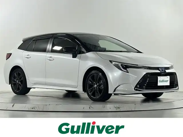 トヨタ カローラツーリング ハイブリッド ダブルバイビー 佐賀県 2023(令5)年 3.2万km アティチュードブラックマイカ/プラチナホワイトパールマイカ ワンオーナー/純正10.5インチディスプレイオーディオ/フルセグ/Bluetooth/バックカメラ/衝突被害軽減システム/レーダークルーズコントロール/レーンアシスト/パーキングサポートブレーキ/ロードサインアシスト/クリアランスソナー/ビルトインETC2.0 /前方・後方純正ドライブレコーダー/オートライト/オートマチックハイビーム/ISOFIX/運転席・助手席シートヒーター/ステアリングヒーター/純正フロアマット/純正17インチアルミホイール