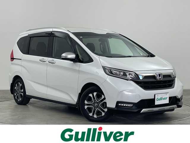 ホンダ フリード ハイブリット クロスター 群馬県 2023(令5)年 4.4万km プラチナホワイトパール 純正９型ナビ　バックカメラ　フルセグＴＶ　両側電動スライドドア　ハーフレザーシート　シートヒーター　クルーズコントロール　衝突被害軽減ブレーキ　レーンアシスト　LEDヘッドライト　オートライト　禁煙車