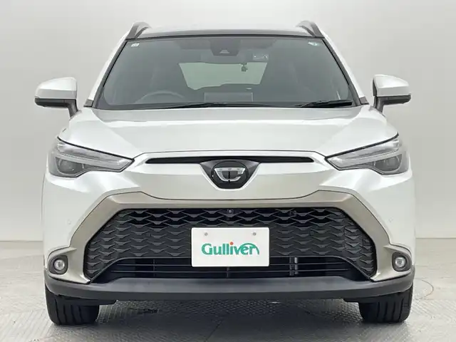 トヨタ カローラ クロス Z 新潟県 2021(令3)年 1.2万km プラチナホワイトパールマイカ ワンオーナー/衝突被害軽減ブレーキ/レーンキープアシスト/ブラインドスポットモニター/パノラマルーフ/純正ナビ/　（BT/USB/AM/FM）/全周囲カメラ/レーダークルーズコントロール/LEDオートライト/ハーフレザーシート/パワーシート/シートヒーター/純正18インチアルミホイール/ステアリングスイッチ/USBポート/スマートキー/ビルトインETC