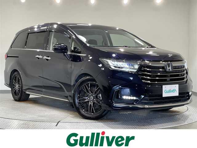 ホンダ オデッセイ ハイブリッド e:HEVアブソルート EX 愛知県 2022(令4)年 5.1万km プレミアムヴィーナスブラックP 純正10インチナビ/　（AM/FM/Bluetooth/フルセグ）/純正フリップダウンモニター/パワーバックドア/両側パワースライドドア/ビルトインETC2.0/ホンダセンシング/　　-衝突軽減ブレーキ（CMBS)/　　-レーダークルーズコントロール（ACC)/　　-誤発進抑制機能/　　-路線逸脱抑制機能/　　-先行車発進お知らせ機能/　　-標識認識機能/　　-オートハイビーム/　　-ブラインドスポットインフォメーション/シートヒーター（D/N)/HDMI/USBソケット/革巻きステアリング/ハーフレザーシート/LEDヘッドライト/フォグランプ/ドライブレコーダー