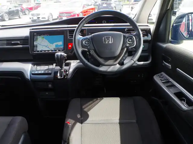 ホンダ ステップワゴン スパーダ ホンダセンシング 大阪府 2020(令2)年 4.5万km プレミアムスパークルブラックパール ホンダセンシング/・衝突軽減ブレーキ（CMBS）/・車線維持支援システム（LKAS）/・アダプティブクルーズコントロール（ACC）/・後方誤発進抑制機能/・誤発進抑制機能/両側パワースライドドア/純正メモリーナビ/地デジTV/【DVD/CD再生機能　Bluetooth接続】/バックカメラ/革巻きステアリング/パドルシフト/ドライブレコーダー（前後撮影）/フリップダウンモニター/ETC（2.0）/LEDヘッドライト/ウインカーミラー/純正16インチアルミホイル/Honda スマートキー