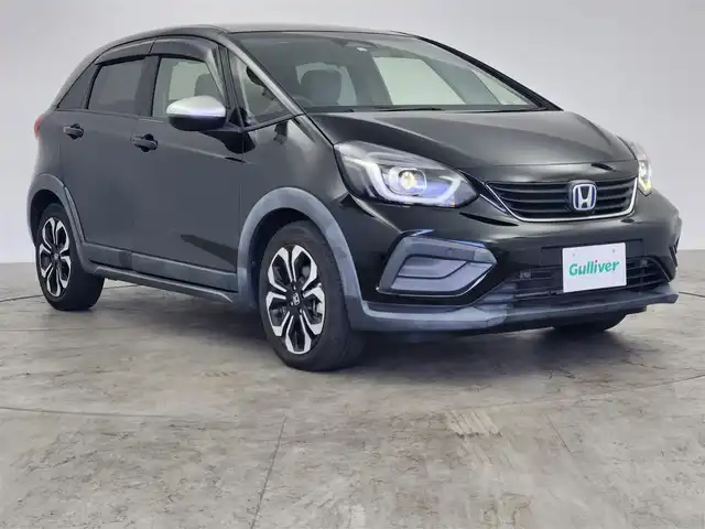 ホンダ フィット e:HEVクロスター 愛知県 2020(令2)年 5.7万km クリスタルブラックパール ホンダセンシング/　　・衝突軽減ブレーキシステム/　　・路外逸脱抑制機能/　　・アダプティブクルーズコントロール/　　・車線維持支援システム/　　・オートハイビーム/純正7インチナビ/USBポート/バックカメラ/ドライブレコーダー/ビルトインETC/革巻きステアリング/ステアリングリモコン/純正LEDヘッドライト/純正16インチアルミホイール/取扱説明書/保証書/スペアキー