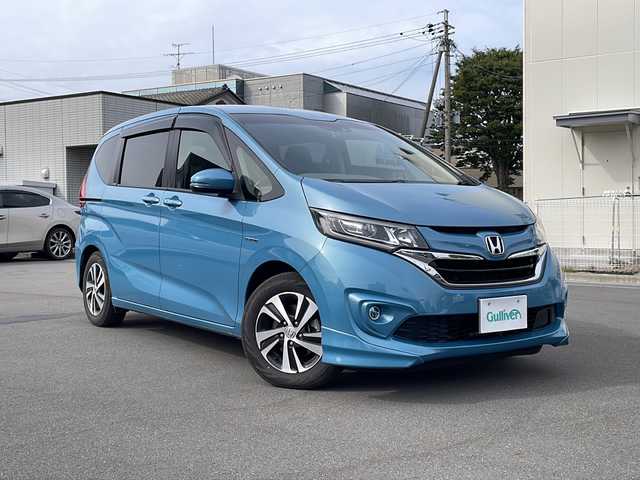 ホンダ フリード ハイブリット EX 長野県 2016(平28)年 6.6万km ブルーホライゾンM ホンダセンシング/・衝突軽減ブレーキ/・誤発進抑制機能/・アダプティブクルーズコントロール/・車線維持支援システム/・歩行者事故低減ステアリング/・路外逸脱抑制機能/・先行車発進お知らせ機能/・標識認識機能/Hondaインターナビ/（CD/DVD/フルセグTV/Bluetooth/HDMI）/バックカメラ/ビルトインETC/両側パワースライドドア/前席シートヒーター/ドライブレコーダー/革巻きステアリング/ステアリングスイッチ/LEDヘッドライト/フォグランプ/スマートキー/Pスタート/電動格納ミラー/純正フロアマット/純正15インチAW/スタッドレス積み込み