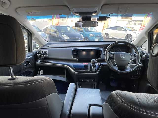 ホンダ オデッセイ ハイブリッド アブソルートセンシングEXパック 大分県 2016(平28)年 8.3万km ホワイトオーキッドパール 純正ナビ（3HU3）/【フルセグTV/Bluetooth/DVD/CD】/Honda SENSING/●衝突軽減ブレーキ 〈CMBS〉/●歩行者事故低減ステアリング/●ACC 〈アダプティブ・クルーズ・コントロール〉/●LKAS 〈車線維持支援システム〉/●路外逸脱抑制機能/●誤発進抑制機能/●先行車発進お知らせ機能/●標識認識機能/マルチビューカメラ/純正リアエンターテイメントシステム/両側パワースライドドア/前後ドラレコ（PDR800FR）/外部端子接続：HDMI・USB/運転席8ウェイパワーシート/LEDヘッドライト/2列目大型ロールサンシェード/2列目オットマン/純正ナビ（テレビ、DVD、FM、、Bluetooth）/ETC/スマートキー/電動格納ミラー/プッシュエンジン/ステアリングスイッチ/チルトステアリング/横滑り防止システム/ドアバイザー/純正フロアマット/スタッドレスタイヤ車載（215/55R17）/保証書/取扱説明書