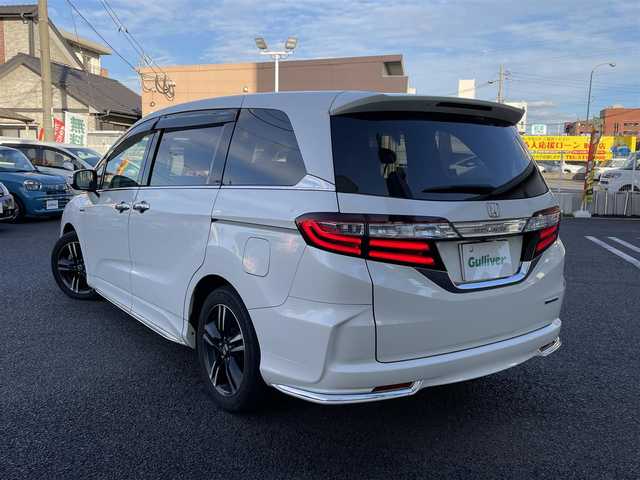 ホンダ オデッセイ ハイブリッド アブソルートセンシングEXパック 大分県 2016(平28)年 8.3万km ホワイトオーキッドパール 純正ナビ（3HU3）/【フルセグTV/Bluetooth/DVD/CD】/Honda SENSING/●衝突軽減ブレーキ 〈CMBS〉/●歩行者事故低減ステアリング/●ACC 〈アダプティブ・クルーズ・コントロール〉/●LKAS 〈車線維持支援システム〉/●路外逸脱抑制機能/●誤発進抑制機能/●先行車発進お知らせ機能/●標識認識機能/マルチビューカメラ/純正リアエンターテイメントシステム/両側パワースライドドア/前後ドラレコ（PDR800FR）/外部端子接続：HDMI・USB/運転席8ウェイパワーシート/LEDヘッドライト/2列目大型ロールサンシェード/2列目オットマン/純正ナビ（テレビ、DVD、FM、、Bluetooth）/ETC/スマートキー/電動格納ミラー/プッシュエンジン/ステアリングスイッチ/チルトステアリング/横滑り防止システム/ドアバイザー/純正フロアマット/スタッドレスタイヤ車載（215/55R17）/保証書/取扱説明書