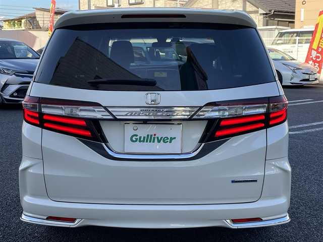 ホンダ オデッセイ ハイブリッド アブソルートセンシングEXパック 大分県 2016(平28)年 8.3万km ホワイトオーキッドパール 純正ナビ（3HU3）/【フルセグTV/Bluetooth/DVD/CD】/Honda SENSING/●衝突軽減ブレーキ 〈CMBS〉/●歩行者事故低減ステアリング/●ACC 〈アダプティブ・クルーズ・コントロール〉/●LKAS 〈車線維持支援システム〉/●路外逸脱抑制機能/●誤発進抑制機能/●先行車発進お知らせ機能/●標識認識機能/マルチビューカメラ/純正リアエンターテイメントシステム/両側パワースライドドア/前後ドラレコ（PDR800FR）/外部端子接続：HDMI・USB/運転席8ウェイパワーシート/LEDヘッドライト/2列目大型ロールサンシェード/2列目オットマン/純正ナビ（テレビ、DVD、FM、、Bluetooth）/ETC/スマートキー/電動格納ミラー/プッシュエンジン/ステアリングスイッチ/チルトステアリング/横滑り防止システム/ドアバイザー/純正フロアマット/スタッドレスタイヤ車載（215/55R17）/保証書/取扱説明書