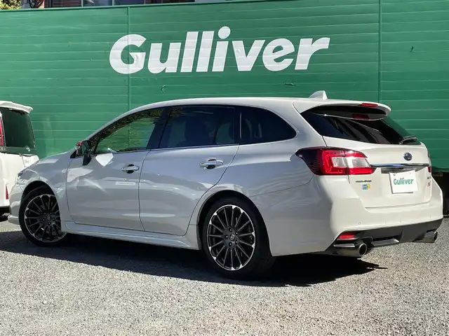 スバル レヴォーグ 2．0STIスポーツアイサイト 東京都 2018(平30)年 3.8万km クリスタルホワイトP サンルーフ/SDナビ/（CD/DVD/BTオーディオ/フルセグ）/バックカメラ/アイサイトツーリングアシスト/・プリクラッシュブレーキ/・アダクティブクルーズコントロール/・車線逸脱ふらつき警報/アイサイトセーフティプラス/・フロント/サイドビューモニター/・スマートリアビューミラー/革スポーツシート/前席パワーシート/純正18インチホイール/ETC/ドライブレコーダー前後/スペアキー/保証書/取扱説明書