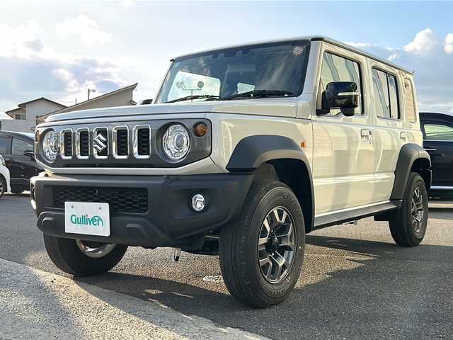 スズキ ジムニー ノマド FC 香川県 2025(令7)年 0.1千km アークティックホワイトパール シートヒーター（D+N席)/背面タイヤ/純正アルミホイール/前後コーナーセンサー/アイドリングストップ/オートライト/LEDヘッドライト/ワンオーナー/４WD/スマートキー