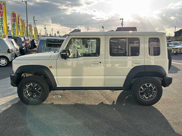 スズキ ジムニー ノマド FC 香川県 2025(令7)年 0.1千km アークティックホワイトパール シートヒーター（D+N席)/背面タイヤ/純正アルミホイール/前後コーナーセンサー/アイドリングストップ/オートライト/LEDヘッドライト/ワンオーナー/４WD/スマートキー