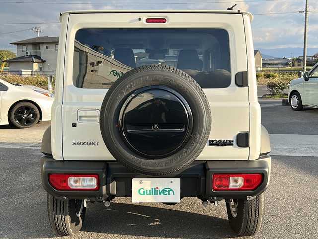 スズキ ジムニー ノマド FC 香川県 2025(令7)年 0.1千km アークティックホワイトパール シートヒーター（D+N席)/背面タイヤ/純正アルミホイール/前後コーナーセンサー/アイドリングストップ/オートライト/LEDヘッドライト/ワンオーナー/４WD/スマートキー