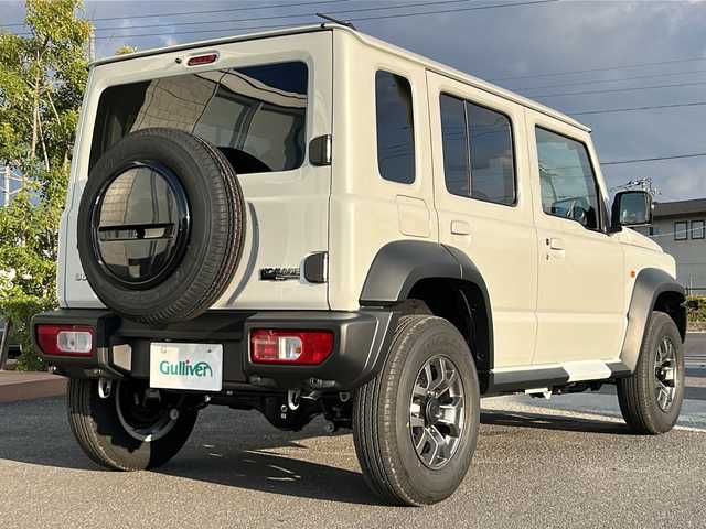 スズキ ジムニー ノマド FC 香川県 2025(令7)年 0.1千km アークティックホワイトパール シートヒーター（D+N席)/背面タイヤ/純正アルミホイール/前後コーナーセンサー/アイドリングストップ/オートライト/LEDヘッドライト/ワンオーナー/４WD/スマートキー