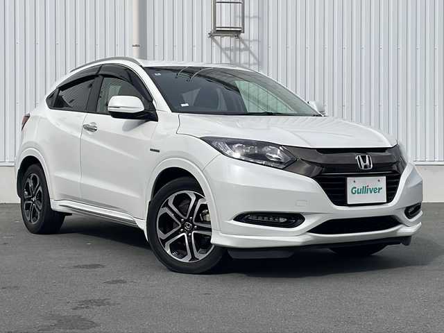 ホンダ ヴェゼル ハイブリッド Z ホンダセンシング 三重県 2016(平28)年 3.3万km ホワイトオーキッドパール 禁煙　/純正ナビ/フルセグTV/バックカメラ/前方ドラレコ/ETC/ハーフレザーシート/シートヒーター/パドルシフト/レーダークルーズコントロール/レーンキープアシスト/衝突被害軽減ブレーキ/トランクションコントロール/寒冷地仕様/ブレーキホールド/LEDオートライト/オートリトラウィンカーミラー/保証書/取扱説明書/スペアスマートキー