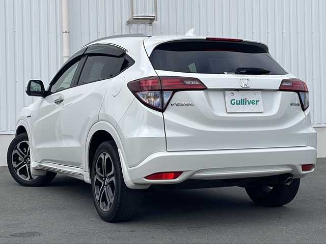 ホンダ ヴェゼル ハイブリッド Z ホンダセンシング 三重県 2016(平28)年 3.3万km ホワイトオーキッドパール 禁煙　/純正ナビ/フルセグTV/バックカメラ/前方ドラレコ/ETC/ハーフレザーシート/シートヒーター/パドルシフト/レーダークルーズコントロール/レーンキープアシスト/衝突被害軽減ブレーキ/トランクションコントロール/寒冷地仕様/ブレーキホールド/LEDオートライト/オートリトラウィンカーミラー/保証書/取扱説明書/スペアスマートキー
