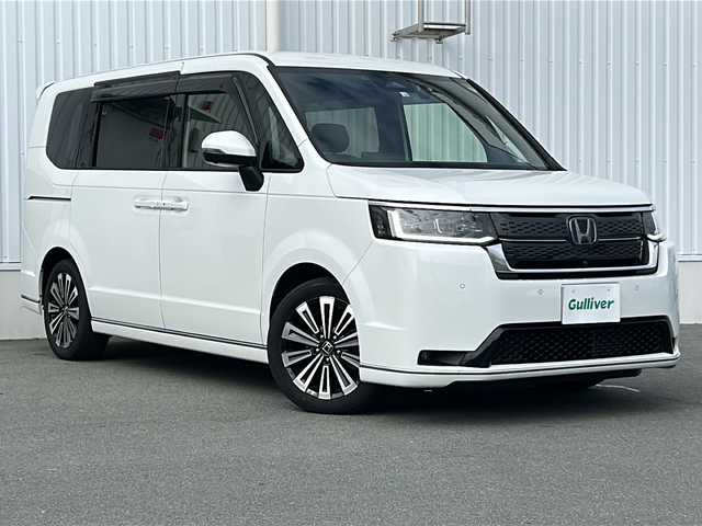 ホンダ ステップワゴン スパーダ eHEV プレミアムライン 三重県 2022(令4)年 5万km プラチナホワイトパール 純正11.4型ナビ /全周囲カメラ /BSM /両側パワースライドドア/ビルトインETC /スペアキー /前後ドドライブレコーダー/1.2列シートヒーター /コーナーセンサー /パワーバックドア/hレーダークルーズコントロール/レーンキープアシスト/衝突軽減ブレーキ/USB・タイプC給電ポート/オットマン/パドルシフト/LEDヘッドライト/オートハイビーム /オートライト/革巻きステアリング/ステアリングスイッチ/純正フロアマット/リヤサンシェード/電子パーキング/ハーフレザーシート /電動格納ミラー/禁煙車