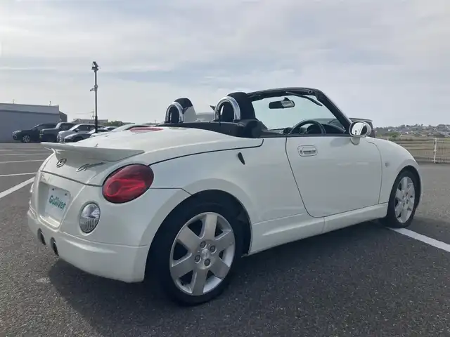 ダイハツ コペン アクティブトップ 鳥取県 2004(平16)年 7.1万km ホワイトパールマイカ ターボ車/電動オープン/社外CDオーディオ/キセノンライト/フォグライト/純正15インチアルミホイール/電動ミラー/キーレスキー/MTモード付きAT/トランクスポイラー/フロアマット