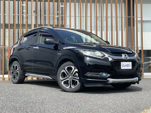 ホンダ ヴェゼル ハイブリッド Z 千葉県 2014(平26)年 10.4万km クリスタルブラックパール (株)IDOMが運営する【じしゃロン八千代店】の自社ローン対象車両になります。こちらは現金またはオートローンご利用時の価格です。自社ローンご希望の方は別途その旨お申付け下さい/純正ナビ（CD・DVD・BT接続可）/フルセグテレビ/ETC/バックカメラ/シートヒーター（D席・N席）/LEDヘッドライト/純正フロアマット