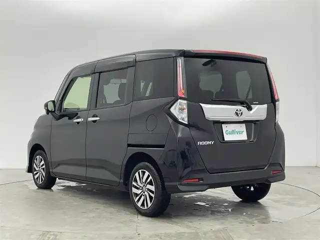 トヨタ ルーミー カスタムG 富山県 2023(令5)年 1.4万km ブラックマイカメタリック 純正9型ディスプレイオーディオ/（AM/FM/BT/USB/フルセグ）/バックカメラ/両側パワースライドドア/衝突被害軽減システム/レーダークルーズコントロール/レーンキープアシスト/コーナーセンサー/横滑り防止装置/アイドリングストップ/オートLEDライト/純正アルミホイール/純正フロアマット/オートホールド付電子パーキング/革巻きステアリング/ステアリングスイッチ/スマートキー/スペアキー