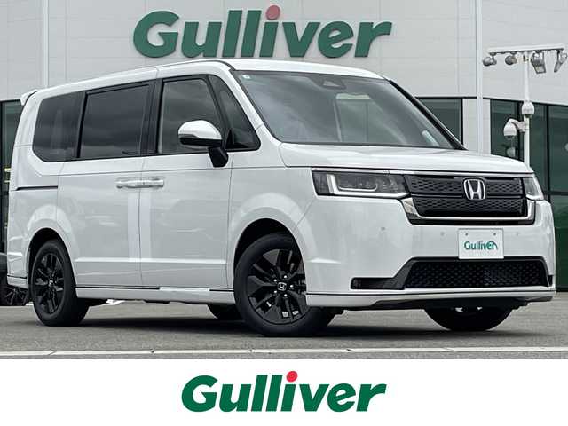 ホンダ ステップワゴン スパーダ eHEV 佐賀県 2025(令7)年 0.1万km未満 プラチナホワイトパール 登録済未使用車「登録時走行距離5km」/ホンダセンシング/衝突軽減ブレーキ/誤発進抑制機能/路外逸脱抑制機能/車線維持支援システム(LKAS)/渋滞追従機能付アダプティブクルーズコントロール/先行車発進お知らせ機能/標識認識機能/LEDオートハイビーム/アダプティブドライビングビーム/ブラインドスポットインフォメーション/11.4インチHonda CONNECTナビ「LXM247VFLi」/AM/FM/Bluetooth/フルセグ/CD/DVD/Apple Car Play/Andoroid Auto//両側パワースライドドア/パワーテールゲート/シートヒーター「運転席/助手席」/後席テーブル/後席サンシェード/オットマン/スマートキー×2