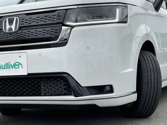 ホンダ ステップワゴン スパーダ eHEV 佐賀県 2025(令7)年 0.1万km未満 プラチナホワイトパール 登録済未使用車「登録時走行距離5km」/ホンダセンシング/衝突軽減ブレーキ/誤発進抑制機能/路外逸脱抑制機能/車線維持支援システム(LKAS)/渋滞追従機能付アダプティブクルーズコントロール/先行車発進お知らせ機能/標識認識機能/LEDオートハイビーム/アダプティブドライビングビーム/ブラインドスポットインフォメーション/11.4インチHonda CONNECTナビ「LXM247VFLi」/AM/FM/Bluetooth/フルセグ/CD/DVD/Apple Car Play/Andoroid Auto//両側パワースライドドア/パワーテールゲート/シートヒーター「運転席/助手席」/後席テーブル/後席サンシェード/オットマン/スマートキー×2