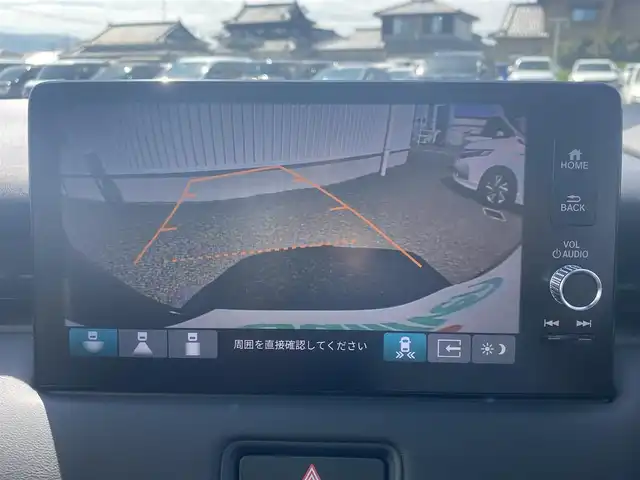 ホンダ ヴェゼル ハイブリッド e:HEV Z 熊本県 2025(令7)年 0.1千km クリスタルブラックパール 保証書/純正ナビ付ディスプレイオーディオ/AM/FM/Bluetooth/AppleCarPlay/AndroidAuto/・バックカメラ/・フルセグTV/・ビルトインETC2.0/ホンダセンシング/クルーズコントロール（追従あり）/ABS/横滑り防止装置/コーナーセンサー（前後）/レーンキープアシスト/盗難防止装置/衝突被害軽減システム/踏み間違い衝突軽減システム/ブラインドスポットインフォメーション/パワーバックドア/ハーフレザーシート/・シートヒーター（D/N)/純正革巻きステアリング/・ステアリングスイッチ/・ステアリングパドル/・ステアリングヒーター/・プッシュスタート/スマートキー/・スペアキー/LEDヘッドライト/・フォグランプ/・オートライト/電動格納ミラー/・ウィンカーミラー/置くだけ充電/電子パーキング/ブレーキホールド/純正アルミホイール