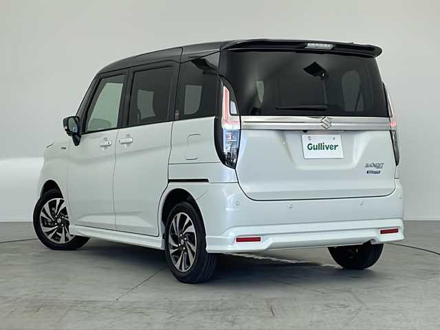 スズキ ソリオ バンディット HV MV 愛知県 2025(令7)年 1.2万km ピュアホワイトパール/ガンメタリック2トーン 禁煙車/純正ナビ(AM/FM/CD/DVD/BT/USB/HDMI/フルセグ/カープレイ/ドロオート)/全方位カメラ/ETC/ドライブレコーダー前後/全席シートヒーター/純正15インチアルミホイール/デュアルブレーキサポートII/前後方誤発進抑制/前後方低速時ブレーキサポート/フロントリヤパーキングセンサー/レーンキープアシスト/ふらつき警報/クルーズコントロール/LEDヘッドライト/オートライト/フォグランプ/両側パワースライドドア/アイドリングストップ/後席サンシェード/電動格納ミラー/革巻きステアリング/純正フロアマット/イモビライザー