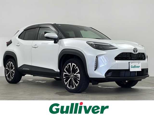 トヨタ ヤリスクロス ハイブリッド Z 鹿児島県 2024(令6)年 0.4万km プラチナホワイトパールマイカ スマートキー×2/純正ディスプレイオーディオ/全方位カメラ/前後ドライブレコーダー（HDR965GW）/BSM/トヨタセーフティセンス/・プリクラッシュセーフティ/・レーンデパーチャーアラート/・レーンキープアシスト/・レーダークルーズコントロール/・オートマチックハイビーム/ハーフレザーシート/D席パワーシート/D/N席シートヒーター/ビルトインETC/LEDヘッドライト/純正フロアマット/ドアバイザー/純正18インチアルミホイール/保証書/取扱説明書
