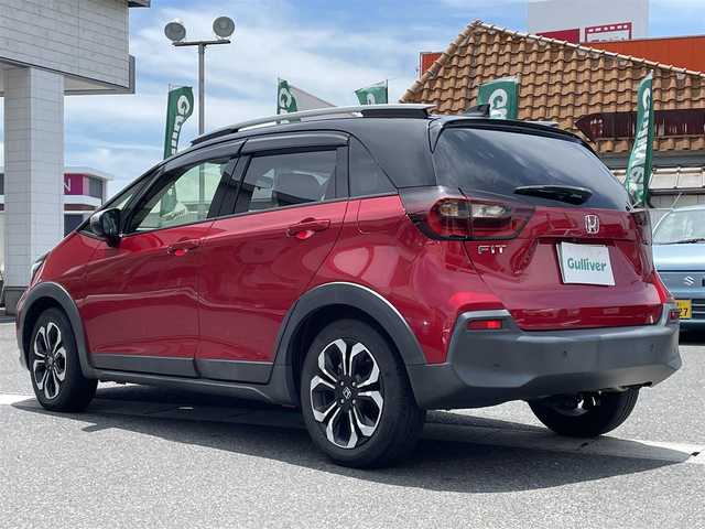 ホンダ フィット クロスター 岡山県 2020(令2)年 5万km プレミアムクリスタルレッドM 登録時走行距離49901キロ/純正9インチプレミアムインターナビ/AM/FM/Bluetooth/TV/SD/CD/DVD/ホンダセンシング/・衝突軽減ブレーキ/・アダプティブクルーズコントロール/・車線逸脱警報/コーナーセンサー/バックカメラ/純正16インチAW/前ドライブレコーダー/純正フロアマット/プッシュスタート/スマートキー/ETC