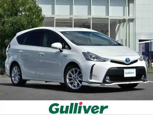 トヨタ プリウス α G ツーリングセレクション 鹿児島県 2015(平27)年 8.4万km ホワイトパールクリスタルシャイン モデリスタエアロ（リア／フロントスポイラー）　/クルーズコントロール　/ビルトインＥＴＣ　/前後ドライブレコーダー　/社外ＳＤナビ（ＭＤＶ－Ｘ７０２Ｗ）　/Ｂｌｕｅｔｏｏｔｈオーディオ　/バックカメラ　/フルセグテレビ/D席パワーシート/ハーフレザーシート/プッシュスタート/スマートキー/アイドリングストップ/カーテンエアバッグ/エアバッグ(W+サイド)