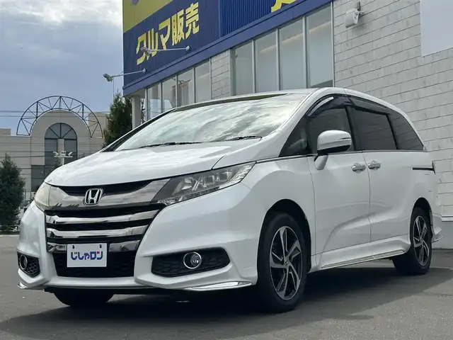 ホンダ オデッセイ アブソルート 道北・旭川 2015(平27)年 14万km ホワイトオーキッドパール (株)IDOMが運営する【じしゃロン旭川店】の自社ローン専用車両になります。こちらは現金またはオートローンご利用時の価格です。自社ローンご希望の方は別途その旨お申付け下さい/　/・純正ナビ(CD/DVD/BT/フルセグ)/・バックカメラ/・ETC/・レーダーブレーキ/・クルーズコントロール/・パドルシフト/・ステアリングリモコン/・両側パワースライドドア/・プッシュスタート/・スマートキー1個/・フォグランプ