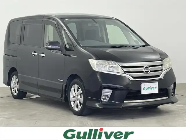 日産 セレナ ハイウェイスター S HV エアロ 大分県 2013(平25)年 8.7万km スーパーブラック 純正ナビ　型式MC312D-W/　AM/FM/CD/DVD/BT/　USB入力端子/　フルセグTV/バックカメラ/後席モニター　型式PCX-R3300/両側パワースライドドア/クルーズコントロール/ETC/プッシュスタート/アイドリングストップ/横滑り防止装置/電動格納ミラー/純正フロアマット/オートライト/HIDヘッドライト/フォグランプ/純正16インチアルミホイール
