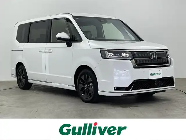 ホンダ ステップワゴン スパーダ eHEV 大分県 2025(令7)年 0.1万km未満 プラチナホワイトパール 純正11.4型ナビ/フルセグ/DVD/Bluetooth/バックカメラ/ホンダセンシング/レーダークルーズコントロール/減速セレクター/オートハイビーム/全列USBチャージャー/前席シートヒーター/パワーテールゲート/両側パワースライドドア/オートLEDライト/パドルシフト/スマートキー