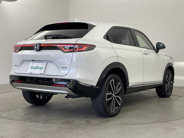 ホンダ ヴェゼル ハイブリッド e:HEV Z 兵庫県 2021(令3)年 5.1万km プラチナホワイトパール ・純正ナビ＆BT＆CD/・バックカメラ/・ホンダセンシング/・路外逸脱抑制機能/・踏み間違い衝突軽減システム/・CMBS/・標識認識機能/・先行車発進お知らせ/・レーダークルーズコントロール/・前後コーナーセンサー/・ブラインドスポットインフォメーション/・フロントワイパーデザイアー/・ドアミラーヒーター/・パドルシフト/・前席シートヒーター/・コンフォートビュー/・ステアリングヒーター/・LEDライト/・ハーフレザーシート/・フォグランプ/・オートライト/・オートマチックハイビーム/・スマートキー/・プッシュスタート/・パワーバックドア