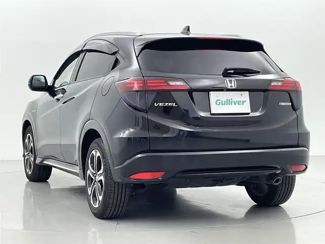 ホンダ ヴェゼル ハイブリッド Z ホンダセンシング 熊本県 2017(平29)年 7.7万km クリスタルブラックパール 禁煙車/純正８型ナビVXM-165VFEi（フルセグTV・AM・FM・Bluetooth・USB）/アルパインフリップダウンモニター/バックカメラ/レーダークルーズコントロール/ETC/前席シートヒーター/ホンダセンシング/衝突軽減ブレーキ/レーンキープアシスト/横滑り防止/ダウンヒルアシスト/ハーフレザーシート/社外フロアマット/純正17インチAW/オートライト/LEDオートライト/フォグランプ/ルーフレール/スマートキー/プッシュスタート