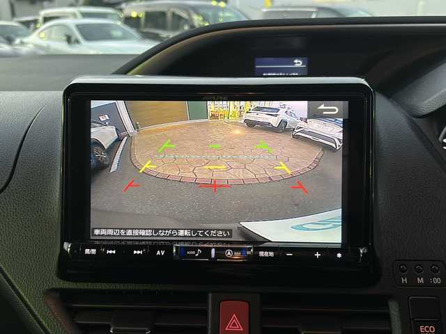 トヨタ ヴォクシー ZS 煌 佐賀県 2015(平27)年 9.7万km アイスチタニウムマイカメタリック エンジンスタートボタン/保証書/取扱説明書/記録簿/MTモード付AT/アイドリングストップ/スマートキー/スペアキー有/Bluetooth接続/後席用モニター/CD再生/USB入力端子/ビルトインETC/バックカメラ/ワンセグTV/メモリナビ/３列シート/前後ドライブレコーダー/ウォークスルー/両側パワースライドドア/ABS/純正アルミホイール/レーンキープアシスト/オートライト/LEDライト/革巻ステアリング/ステアリングスイッチ