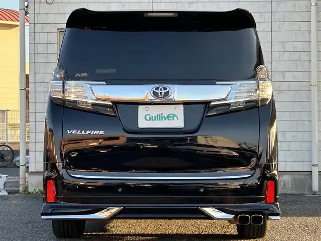 トヨタ ヴェルファイア Z Gエディション 福岡県 2015(平27)年 7.4万km ブラック モデリスタエアロ(リア)/フロントガーニッシュ/ツインムーンルーフ/純正10.1インチフリップダウンモニター/JBLプレミアムサウンド/純正9インチメーカーナビ/(AM/FM/CD/DVD/Bluetooth/フルセグTV)/全方位カメラ/バック/フロント/サイドカメラ/運転支援/・プリクラッシュセーフティシステム/・クリアランスソナー/・レーダークルーズコントロール/横滑り防止/純正18インチアルミホール/両側パワースライドドア/パワーバックドア/純正LEDスタイリッシュビーム(フロントガーニッシュ用)/黒レザーシート/レーダー探知機【ASSURA AR-W51GA】/ビルトインETC/純正インテリアイルミネーション/純正スカッフイルミネーション/ステアリングヒーター/革巻きステアリング/ステアリングスイッチ/パワーシート(D/N)/シートヒーター(D/N)/シートメモリー(D)/オットマン(N/セカンドシート)/後席電動サンシェード/純正フロアマット/ナノイー/ドアバイザー/ブレーキホールド/プッシュスタート/USBポート/スペアキー×1/100V電源/ISOFIX/保証書/取説、ナビ取説