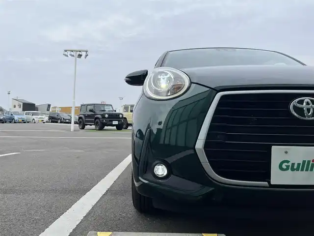 トヨタ パッソ モーダ　Gパッケージ 香川県 2019(平31)年 2.9万km ダークエメラルドマイカ 社外メモリーナビ/→AM/FM/CD/DVD/Bluetooth/フルセグTV/前後ドライブレコーダー/衝突軽減ブレーキ/ビルトインＥＴＣ/アイドリングストップ/LEDヘッドライト/コーナーセンサー/オートハイビーム/シートヒーター/プッシュスタート/スマートキー/スペアキー×1/革巻きステアリング/ステアリングスイッチ/純正フロアマット/純正14インチアルミホイール