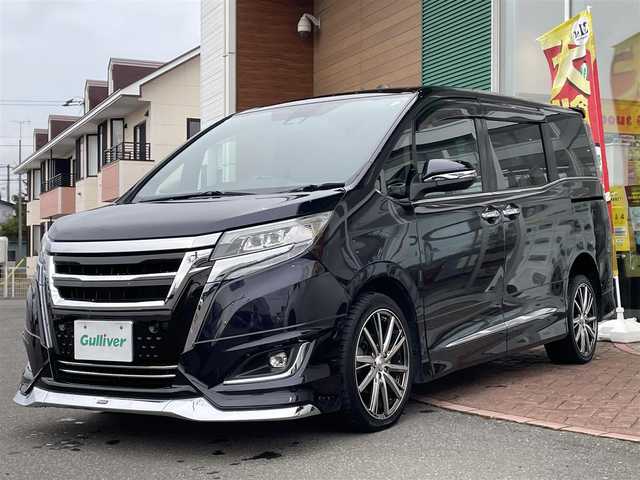 トヨタ エスクァイア Gi 道央・札幌 2019(令1)年 3.6万km ブラック ４WD/純正SDナビ(AM/FM/CD/DVD/BT/SD)/フルセグテレビ(走行中視聴可能)/バックカメラ/アイドリングストップ/ウィンカーミラー/キャプテンシート/クルーズコントロール/ステアリングスイッチ/ドアバイザー/プッシュスタート/両側パワースライドドア/ビルトインETC/前席シートヒーター/レーンキープアシスト/横滑り防止装置/盗難防止装置/オートライト/フォグランプ/防眩ミラー/積込冬タイヤ/　　（純正AW/195/６５R15 19年製溝7ｍｍ）/積込エアロ（ＴＲＤ）