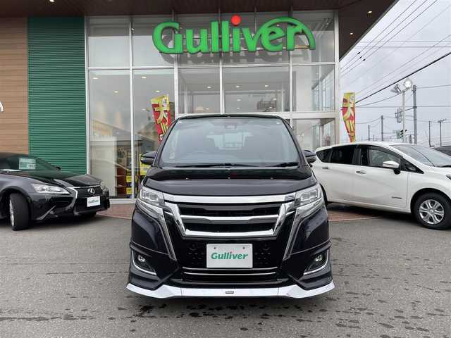 トヨタ エスクァイア Gi 道央・札幌 2019(令1)年 3.6万km ブラック ４WD/純正SDナビ(AM/FM/CD/DVD/BT/SD)/フルセグテレビ(走行中視聴可能)/バックカメラ/アイドリングストップ/ウィンカーミラー/キャプテンシート/クルーズコントロール/ステアリングスイッチ/ドアバイザー/プッシュスタート/両側パワースライドドア/ビルトインETC/前席シートヒーター/レーンキープアシスト/横滑り防止装置/盗難防止装置/オートライト/フォグランプ/防眩ミラー/積込冬タイヤ/　　（純正AW/195/６５R15 19年製溝7ｍｍ）/積込エアロ（ＴＲＤ）