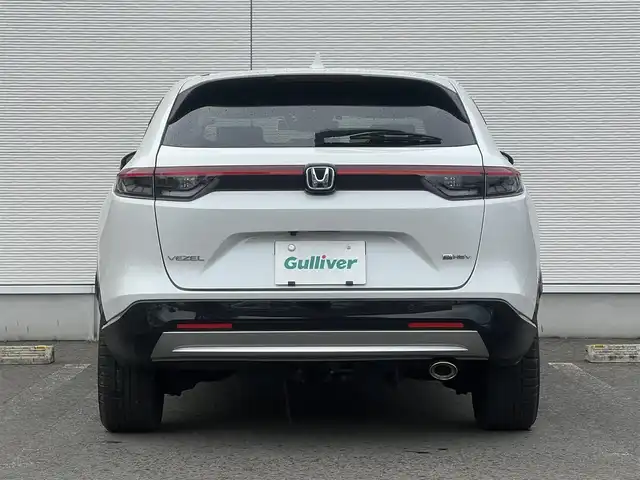ホンダ ヴェゼル ハイブリッド e:HEV Z 秋田県 2021(令3)年 3.7万km プラチナホワイトパール ４WD/衝突軽減システム/LEDヘッドライト/社外１８インチアルミ（冬タイヤ装着）/スマートキー/アイドリングストップ/プッシュスタート/コーナーセンサー/クルーズコントロール追従走行あり/ダウンヒルアシストコントロール/オートマチックハイビーム/レーンキープアシスト/ブラインドスポットモニター/ステアリングスイッチ/ステアリングヒーター/パドルシフト/前席シートヒーター/ビルトインETC/ドライブレコーダー/電動リアゲート/電動パーキングブレーキ/オートブレーキホールド機能/社外フロアマット/社外ドアバイザー/オートライト/オートエアコン/パワーステアリング/パワーウィンドウ/横滑り防止/盗難防止装置/寒冷地仕様/電動格納ウィンカーミラー