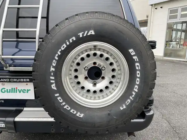 トヨタ ランドクルーザー VX 三重県 1995(平7)年 10.3万km ダークブルーマイカM 登録時103022km/SR/禁煙車/グリルガード/背面タイヤ/４WD/社外ナビ【AVIC-RZ900】/（AM/FM/TV/Bluetooth）/フルセグTV/ETC/デフロック/オートライト/記録簿（H07.08/27・H12.02/24・H16.02/20・H31.02/13・R02.03/06・R03.03/26・R4.03/31・R05.03/02）/保証書