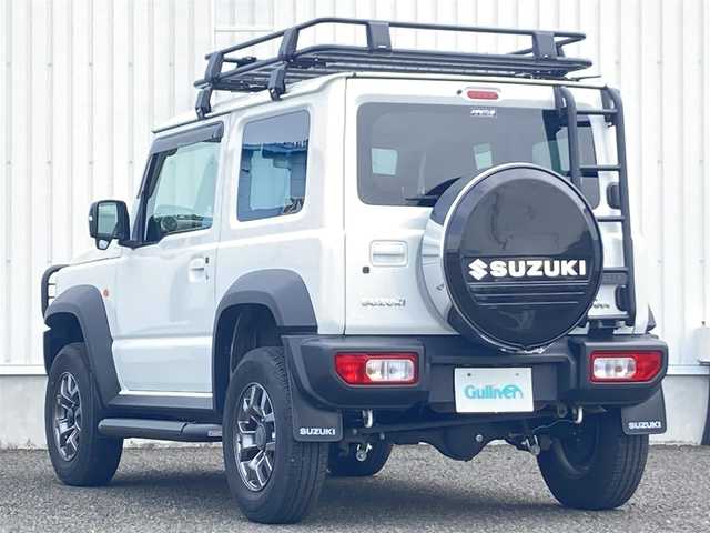 スズキ ジムニー シエラ JC 熊本県 2020(令2)年 4.6万km ピュアホワイトP 純正８型ナビ/・AM/FM/CD/DVD/SD/BT/フルセグTV/・バックカメラ/スズキセーフティサポート/・デュアルセンサーブレーキサポート/・誤発進抑制機能/・標識認識機能/・車線逸脱警報機能/・ふらつき警報機能/・先行車発進お知らせ/GI GEARカスタム/・グリルガード/・サイドステップ/・リフトアップ/・ルーフラック/・リアラダー/・ルーフラックカーゴ/・背面タイヤハードカバー/オレンジレザーシートカバー/クルーズコントロール/ステアリングリモコン/ＥＴＣ/前席シートヒーター/オートライト/ＬＥＤヘッドライト/フォグランプ/純正フロアマット/ドアバイザー/プッシュスタート