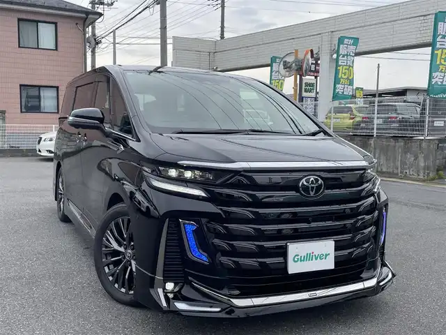 トヨタ ヴェルファイア Z プレミア 群馬県 2024(令6)年 0.4万km ブラック ワンオーナー/全席パワーシート/全席シートヒーター/全席エアシート/純正ディスプレイオーディオ/ヘッドアップディスプレイ/シートメモリー/キャプテンシート/純正フリップダウンモニター/純正ビルトインETC2.0/ガラスルーフ/オットマン/デジタルインナーミラー/モデリスタエアロ/ユニバーサルステップ/前後ドライブレコーダー/ウッドコンビステアリング/置くだけ充電/ドアバイザー/電動格納ミラー/プッシュスタート/スマートキー×２/LEDヘッドライト