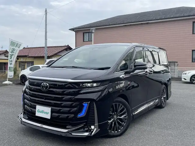 トヨタ ヴェルファイア Z プレミア 群馬県 2024(令6)年 0.4万km ブラック ワンオーナー/全席パワーシート/全席シートヒーター/全席エアシート/純正ディスプレイオーディオ/ヘッドアップディスプレイ/シートメモリー/キャプテンシート/純正フリップダウンモニター/純正ビルトインETC2.0/ガラスルーフ/オットマン/デジタルインナーミラー/モデリスタエアロ/ユニバーサルステップ/前後ドライブレコーダー/ウッドコンビステアリング/置くだけ充電/ドアバイザー/電動格納ミラー/プッシュスタート/スマートキー×２/LEDヘッドライト