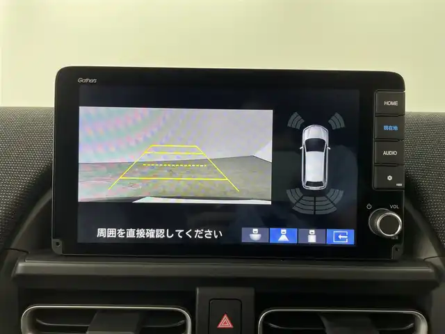 ホンダ フリード ハイブリット e:HEV AIR EX 大分県 2025(令7)年 0.1千km クリスタルブラックパール 登録済未使用車/6人乗り/純正9型ナビ　LXM-242ZFNi/（BT/フルセグTV/AppleCarPlay/AndroidAuto)/バックカメラ/ＨｏｎｄａＳＥＮＳＩＮＧ/・衝突軽減ブレーキ/・誤発進抑制機能/・歩行者事故低減ステアリング/・路外逸脱抑制機能/・渋滞追従機能付きアダプティブクルーズコントロール/・車線維持支援システム/・渋滞運転支援機能/・先行車発信お知らせ機能/・オートハイビーム/ブラインドスポットインフォメーション/リアクーラー/2列目キャプテンシート（アームレスト付）/シートヒーター/両側パワースライドドア/ステアリングリモコン/電動格納ウィンカーミラー/オートライト/LEDヘッドライト/純正15インチアルミホイール/コーナーセンサー/保証書、取説、スペアキー有り