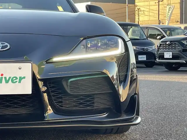 トヨタ スープラ RZ 広島県 2023(令5)年 0.8万km ブラックメタリック ワンオーナー/フルエアロ/レッドキャリパー/純正ナビ（AM/FM/フルセグTV/Bluetooth）/バックカメラ/ETC/ドライブレコーダー/JBLプレミアムサウンド/ハーフレザーシート（ブラック×レッド）/・パワーシート（メモリー機能付き）/・シートヒーター/Toyota Supra Safety/・衝突被害軽減ブレーキ/・車線逸脱警報（操舵支援付き）/・ブラインドスポットモニター/レーダークルーズコントロール/コーナーセンサー/スペアキー