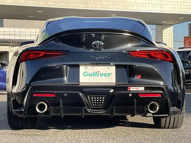 トヨタ スープラ RZ 広島県 2023(令5)年 0.8万km ブラックメタリック ワンオーナー/フルエアロ/レッドキャリパー/純正ナビ（AM/FM/フルセグTV/Bluetooth）/バックカメラ/ETC/ドライブレコーダー/JBLプレミアムサウンド/ハーフレザーシート（ブラック×レッド）/・パワーシート（メモリー機能付き）/・シートヒーター/Toyota Supra Safety/・衝突被害軽減ブレーキ/・車線逸脱警報（操舵支援付き）/・ブラインドスポットモニター/レーダークルーズコントロール/コーナーセンサー/スペアキー